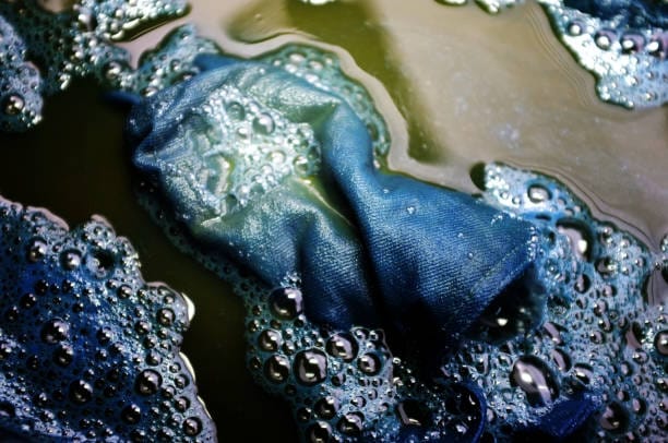 Fabric denim in Indigo water Background .